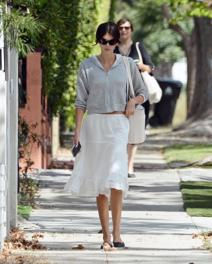 Casual elegance with a hoodie and white skirt